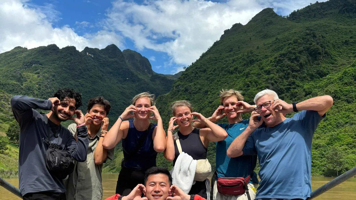 Riders stopped at a viewpoint above the Dong Van karst plateau on a 2-day Ha Giang loop motorcycle tour, northern Vietnam